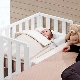 Особенности выбора приставных кроваток для новорожденных